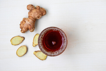 Steaming hot black tea in a clear glass, a traditional and healthy beverage. This aromatic spiced...