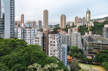 Fototapeta premium View to the skyscarpers of Hong Kong from Blue Pool Road. Cityscape and an endless array of skyscrapers.