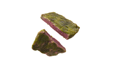 a piece of meat is being cut into pieces