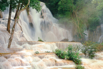 Close up of Kuang Si Waterfalls in Luang Prabang Laos. Long exposure. Beautiful waterfall in wild jungle