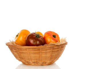 Red juicy tomatoes on a white background, close-up.