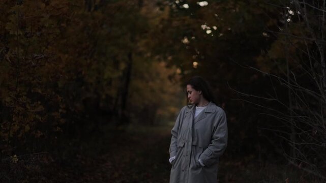 couple in love walking in autumn park on a date in coats