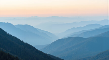 Obraz premium Mountain landscape with layered hills at sunset in blue tones 