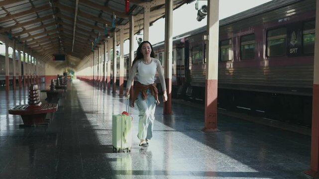 Tourist running with luggage in train station