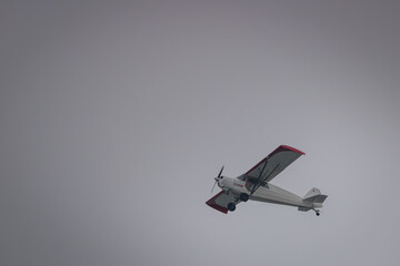 Small propeller plan flying low along the beach