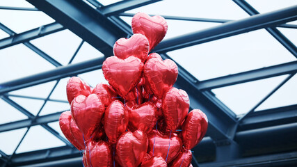 Red Heart-Shaped Balloons Tied As A Valentine's Day Gift