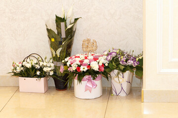 A collection of flower arrangements in decorative pots