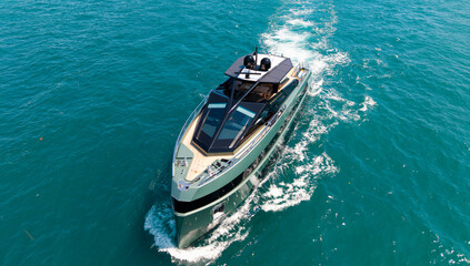 Fototapeta premium Summer vacation. Luxury yacht boat top view. Panorama aerial view on motorboat. Motor boat yacht floating to marina. Motorboat tour by summer sea. Luxury yacht boat at sea. Yacht cruise