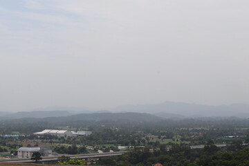 Vast Landscape: A panoramic vista unfolds, with layers of rolling hills and mountains stretching into the horizon, creating a sense of depth, distance, and the boundless beauty of the outdoors.
