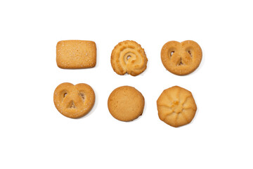 Six different shapes of Danish butter cookies are arranged in two rows, photographed from above. Each cookie is golden brown and isolated on white background.