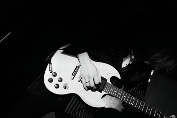 Close-up of a man's hands playing the guitar