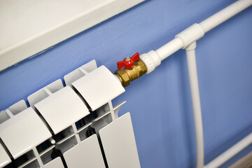 A water radiator for heating. A white radiator for indoor heating.