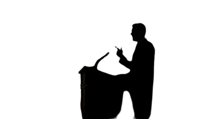 Silhouette Of A Man Giving Speech On Stage Isolated Photo