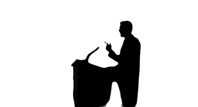 Silhouette Of A Man Giving Speech On Stage Isolated Photo