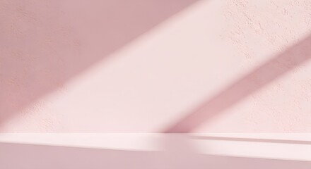 Light pink wall and floor with shadow casting across the surface creating a minimalist backdrop