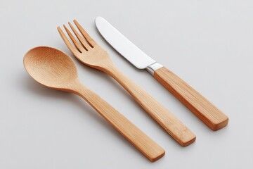 set of eco-friendly minimalistic utensils made from bamboo and metal on plain white background