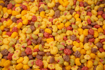 Sweet crunchy cornflakes as a background. Top view.