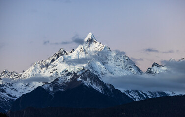 Aerial view of the Golden Mountain bathed in sunlight on Meili Snow Mountain in Yunnan Province