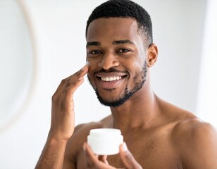 Smiling african american man applying facial moisturizer, promoting healthy male skin.