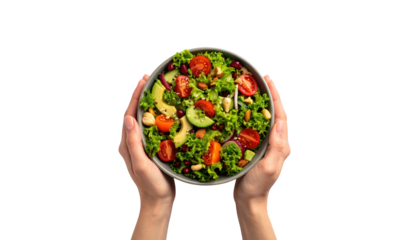 Closeup of hands holding a bowl of fresh, vibrant, and healthy salad fresh