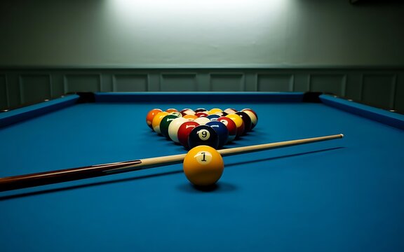 A racked triangle of colorful billiard balls sits on a vibrant blue pool table with a cue stick positioned in the foreground ready for play - Powered by Adobe