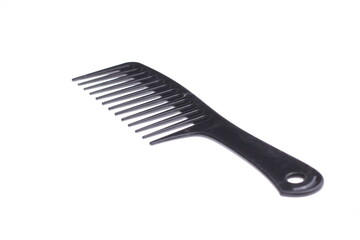 Black hair comb isolated on white background.