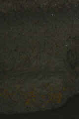 Interior of a cave system with uneven surface.