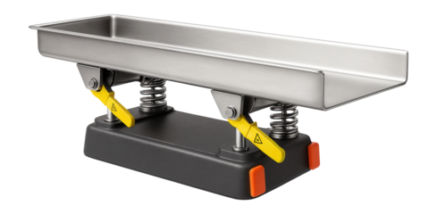 Linear vibrating feeder with a flat pan and spring mounts for a food processing plant.