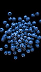 A pile of fresh blueberries on a dark background