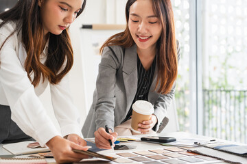 Woman architect designer teamwork select material compare samples finishing. Female interior...