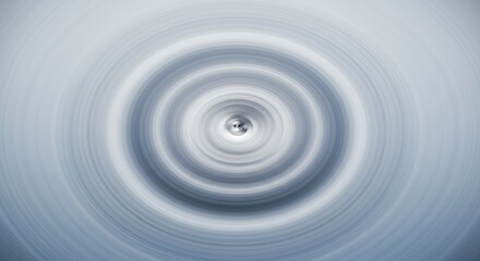 Fototapeta premium Abstract Circular Design: Concentric Rings of Soft Blue and Gray Hues Creating a Vortex Effect