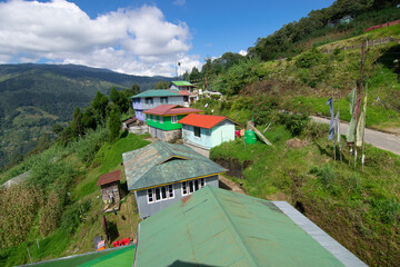 Okhrey village, Himalayan mountain range in the background . Okhrey is a remote village with breath...