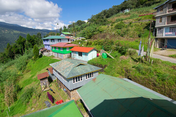 Okhrey village, Himalayan mountain range in the background . Okhrey is a remote village with breath...