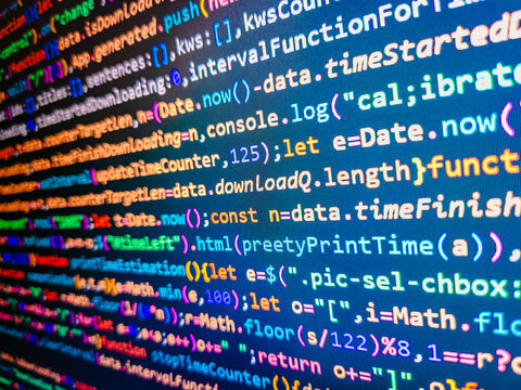 Developer working on program codes in office. Abstract modern virtual computer script. Developer working on software codes in office. Software developer programming code on computer. Source code photo