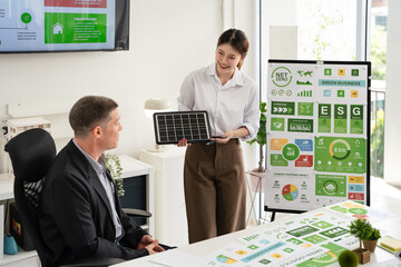 A businessman in meeting room, presenting Net Zero and ESG targets.