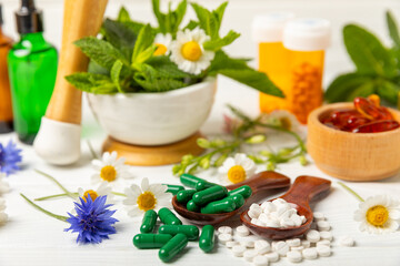 Alternative medicine herbal capsule organic drug on wooden background.Assortment of herbal and tablets,vitamins and dietary supplements.medicinal and Healing herbs.natural supplements for healthy life
