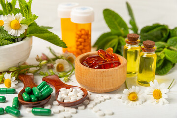 Alternative medicine herbal capsule organic drug on wooden background.Assortment of herbal and tablets,vitamins and dietary supplements.medicinal and Healing herbs.natural supplements for healthy life
