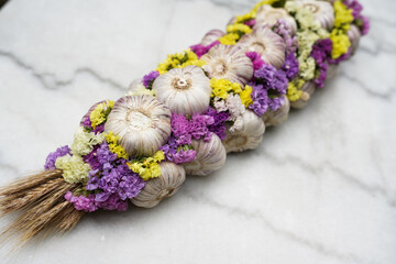 Fresh garlic with colorful flowers. Close up. 