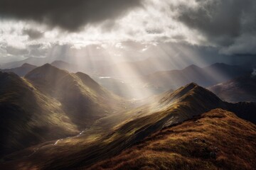 Sun Rays Breaking Through Clouds Over Grassy Mountains and Valley