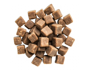 Overhead view of a pile of dog food kibble pieces in small square shapes transparent background