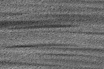 gray background, photo shows concrete wall texture and paint lines