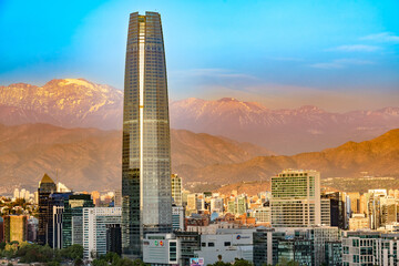 A stunning panoramic view of Santiago, Chile, where the city's architecture meets the grandeur of the Andes at sunset.
