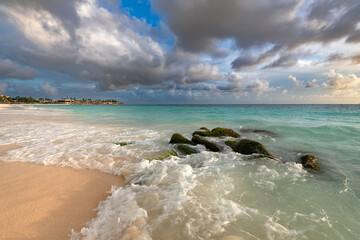 The serene beauty of Divi Beach in Aruba, featuring its iconic white sand, clear waters, and resort backdrop.