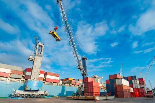 Iquique, Chile: Container cranes load and unload cargo at the port, a hub of maritime trade and logistics.