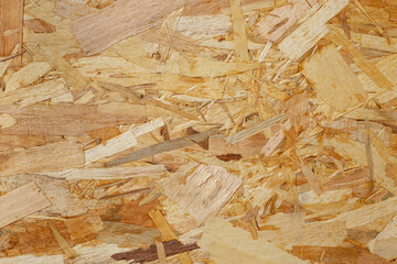 OSB wood chips pressed sheet structure, abstract empty backdrop, close up