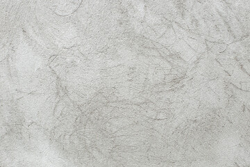 Gray cement stucco structure, grainy surface with scratches , abstract textured backdrop