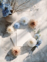 dried flowers arrangement blue hydrangea and thistle on white linen fabric with shadows minimalist still life
