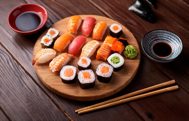 Top view of a gourmet sushi platter served on a wooden board with chopsticks, soy sauce, and wasabi on the side, elegant Japanese restaurant setting, natural lighting
