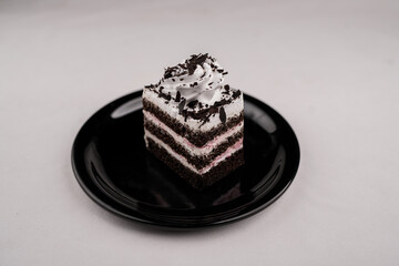 Delicious black forest cake slice on black plate