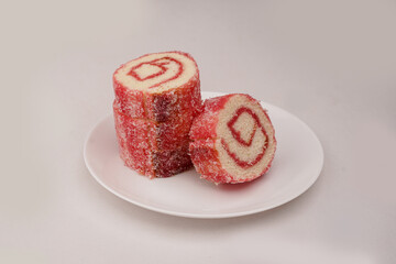Delicious jam bread roll cake on white plate